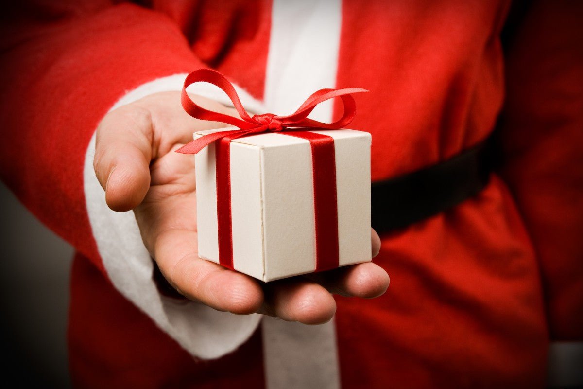 Santa Claus with Christmas gift in hand