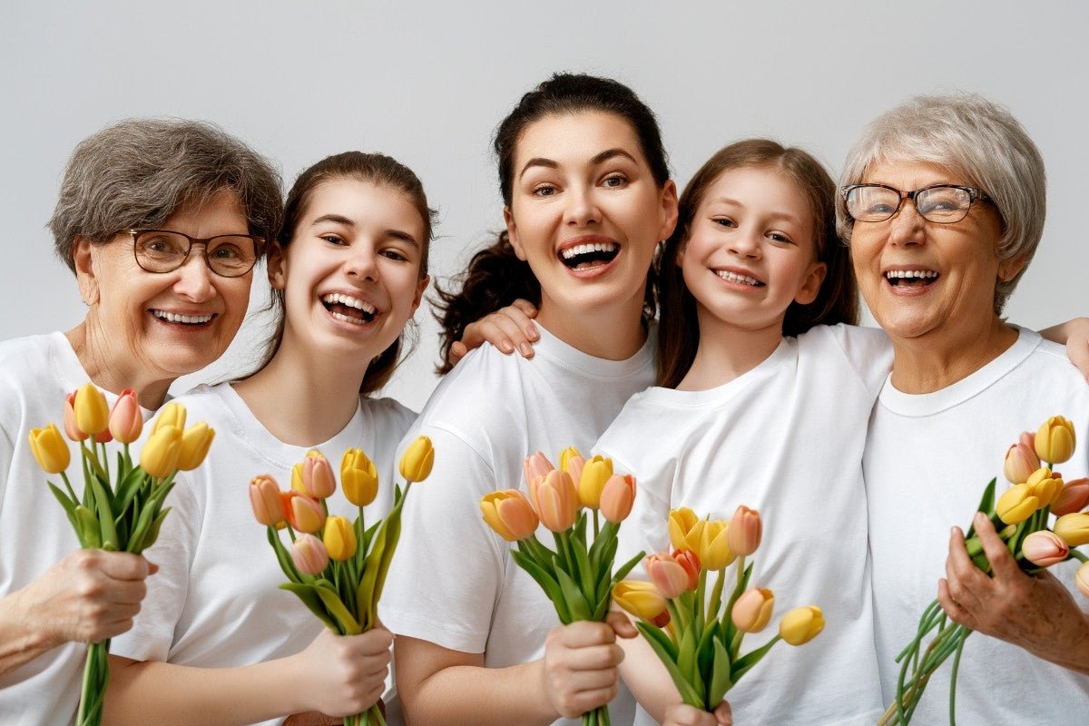 Women holding flower gifts on International Women's Day